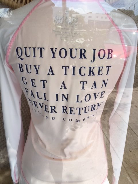Lightweight slogan jacket says "Quit Your Job, Buy A Ticket, Get A Tan, Fall In Love, Never Return" Island Company
